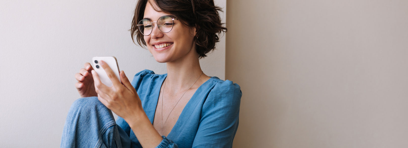 woman wearing large designer frames